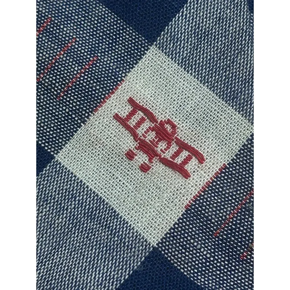 Boys blue clip on tie featuring a plane
